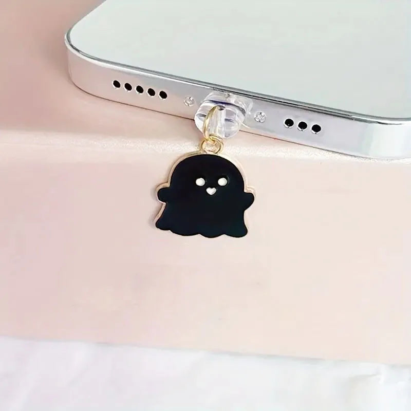 Black and white ghost phone dust plug